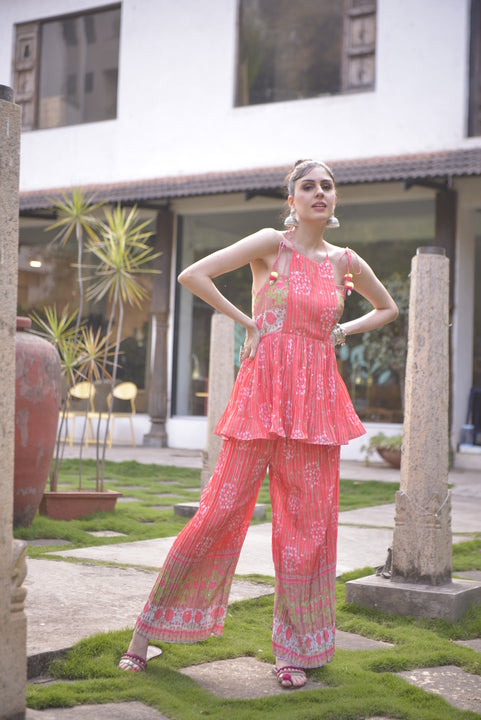 Orange sleeveless kurta palazzo set with peplum kurta and floral print